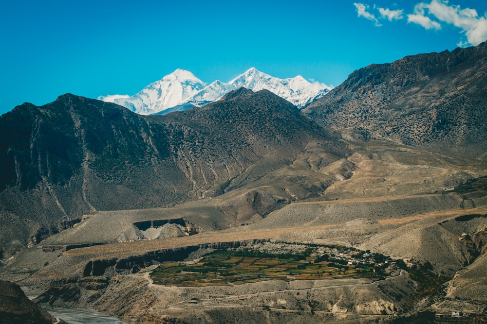 a mountain range with a river running through it