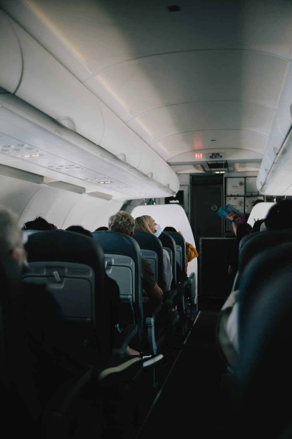 a group of people sitting inside of an airplane