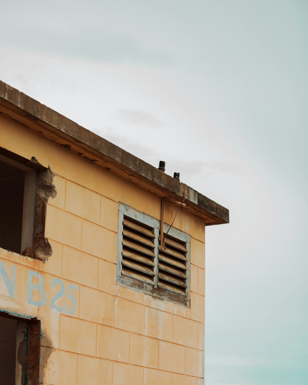 brown concrete building under white sky during daytime