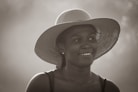 woman in brown sun hat