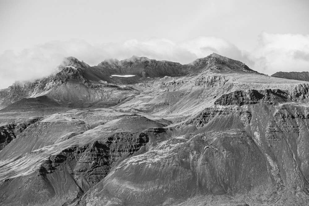 a black and white photo of a mountain range