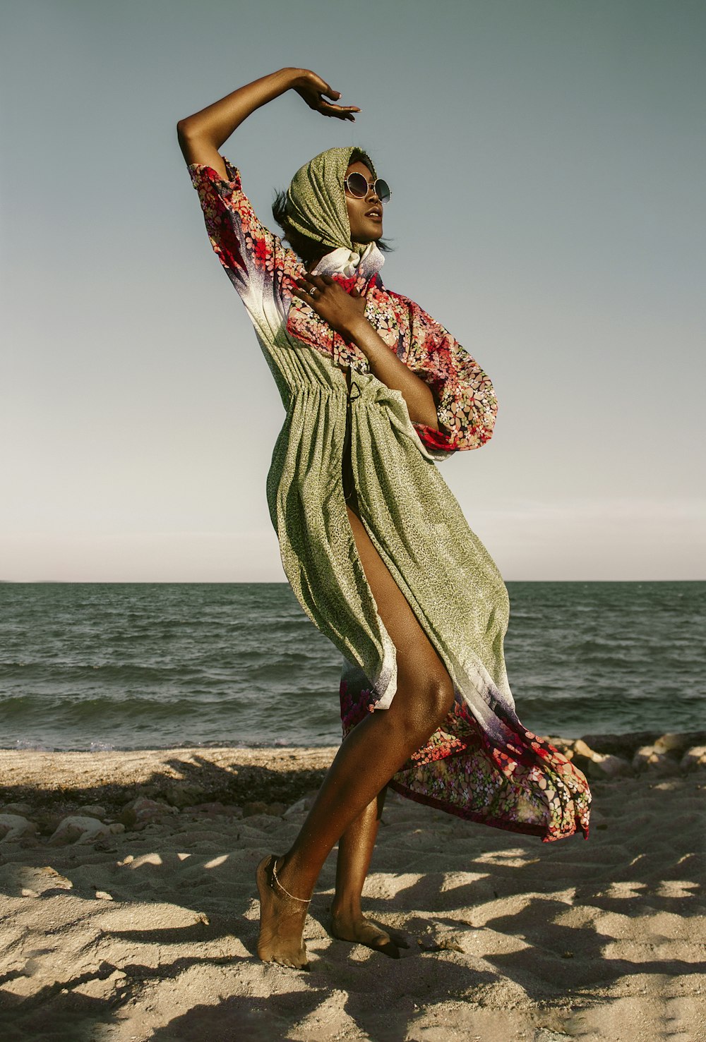 a woman in a dress on the beach