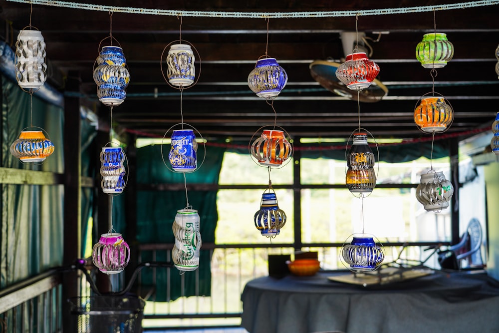a group of glass vases hanging from a ceiling