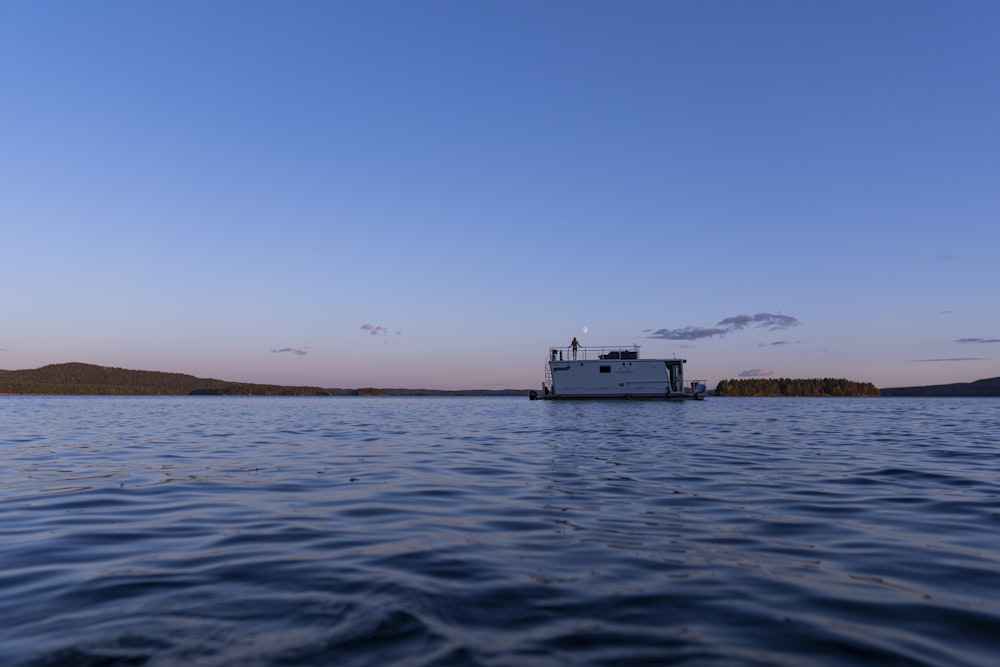 a boat floating on top of a large body of water