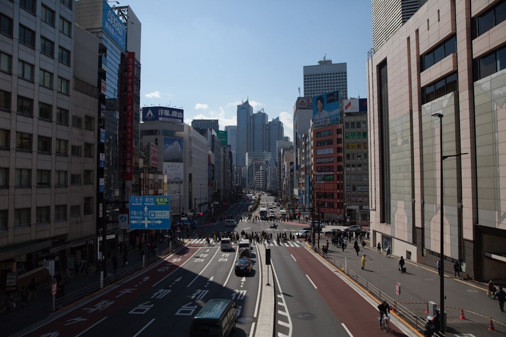 a city street filled with lots of tall buildings