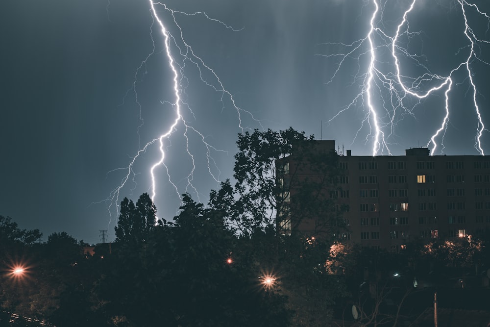 a large building with a lot of lightning in the sky