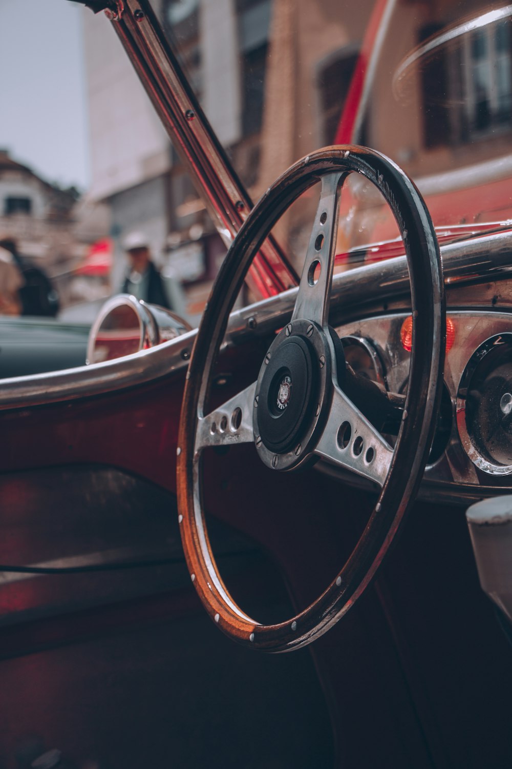 a steering wheel and dashboard of an old car