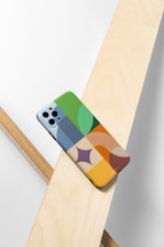 a phone case sitting on top of a wooden table