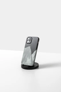 a black and white picture of a cell phone