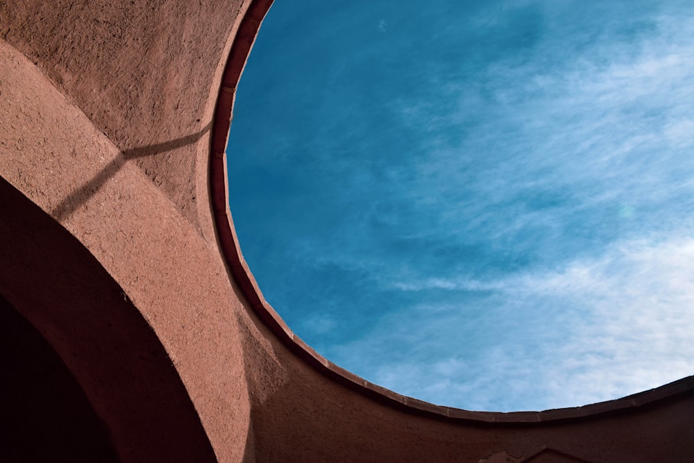 a view of the sky through a circular window