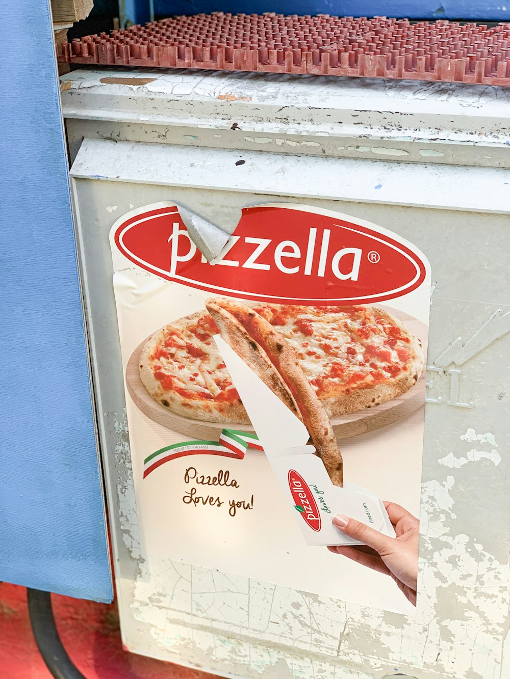 a pizza box with a large piece of pizza on it