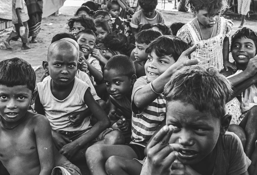 a group of children sitting next to each other