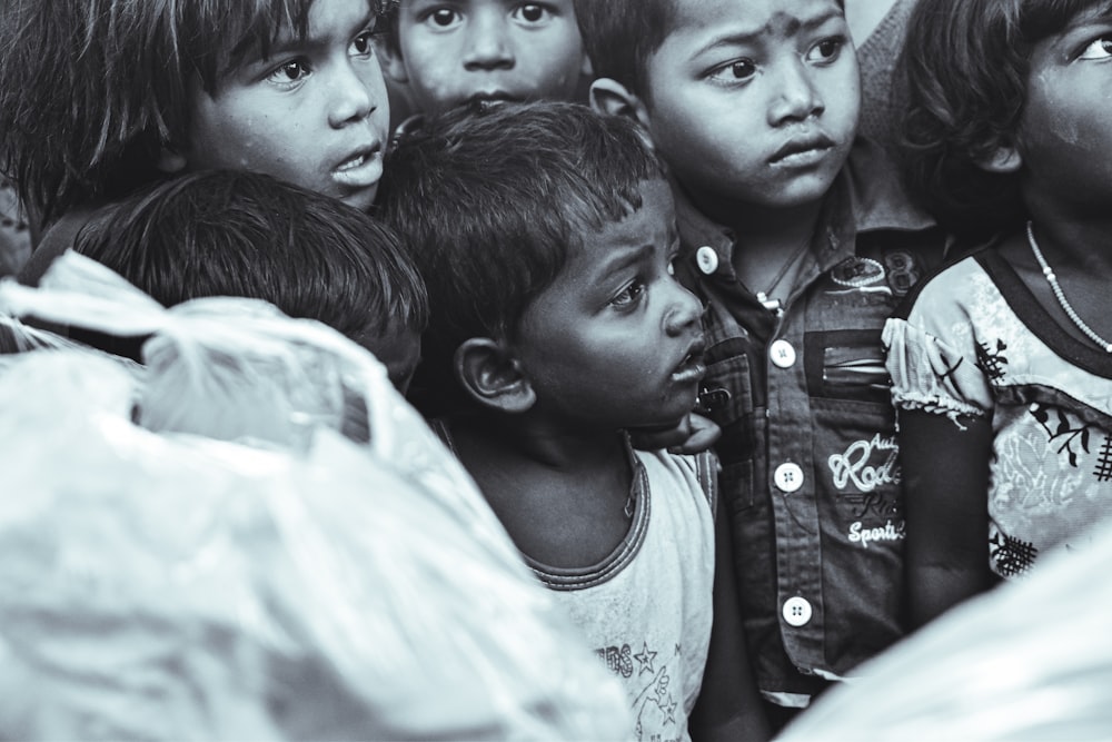 a group of young children standing next to each other