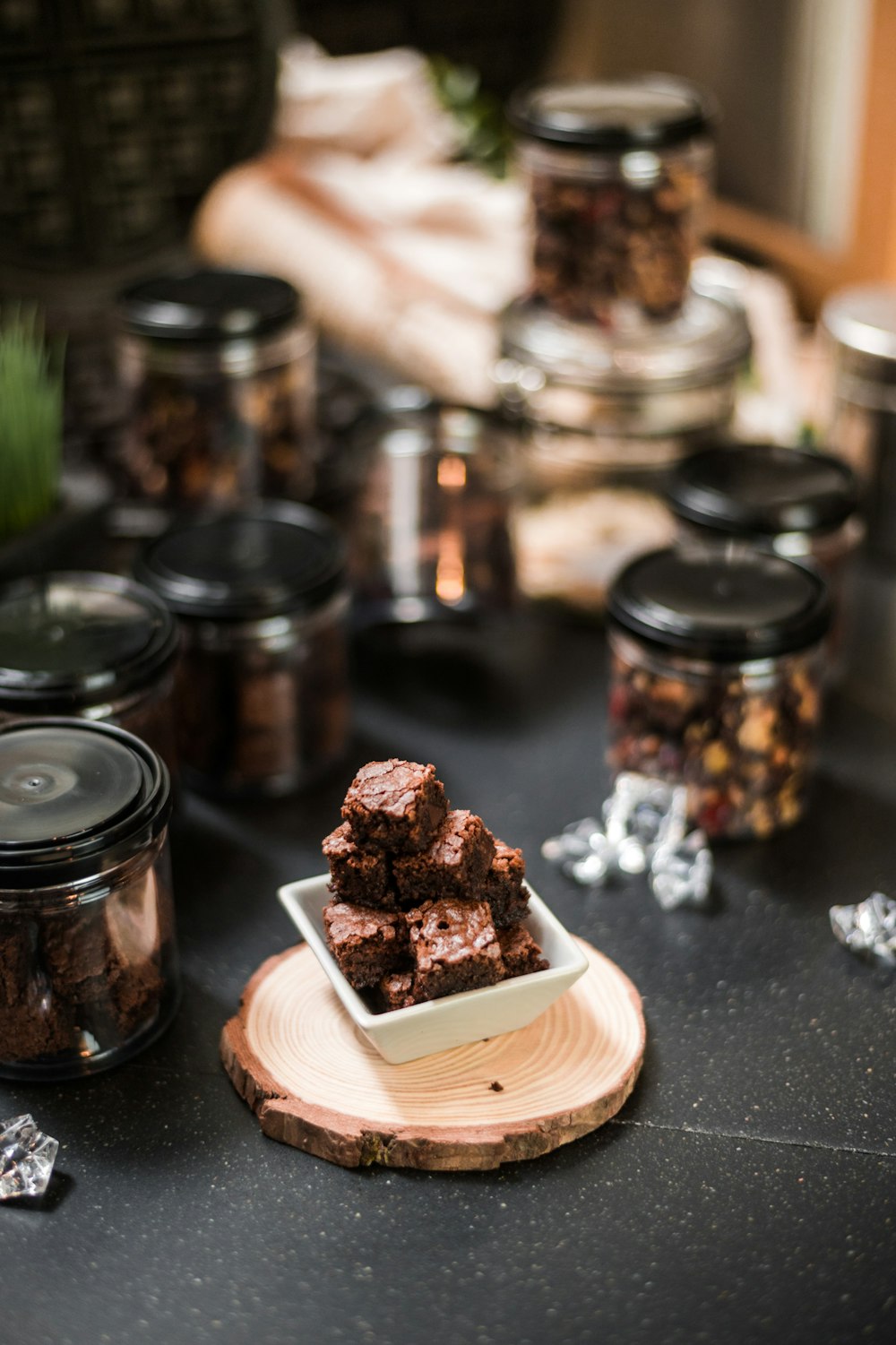 a plate of brownies sitting on top of a table