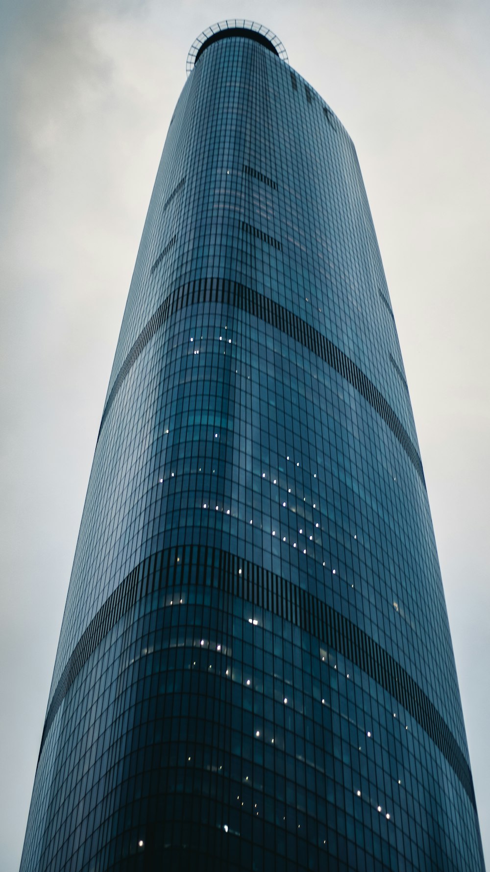 a very tall building with a sky background