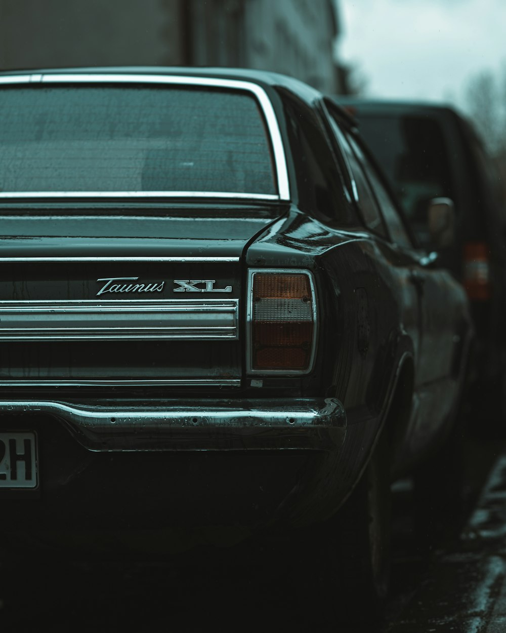 a black car parked on the side of the road