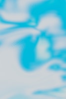 a blurry image of a blue sky with clouds
