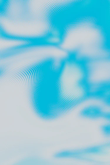 a blurry image of a blue sky with clouds