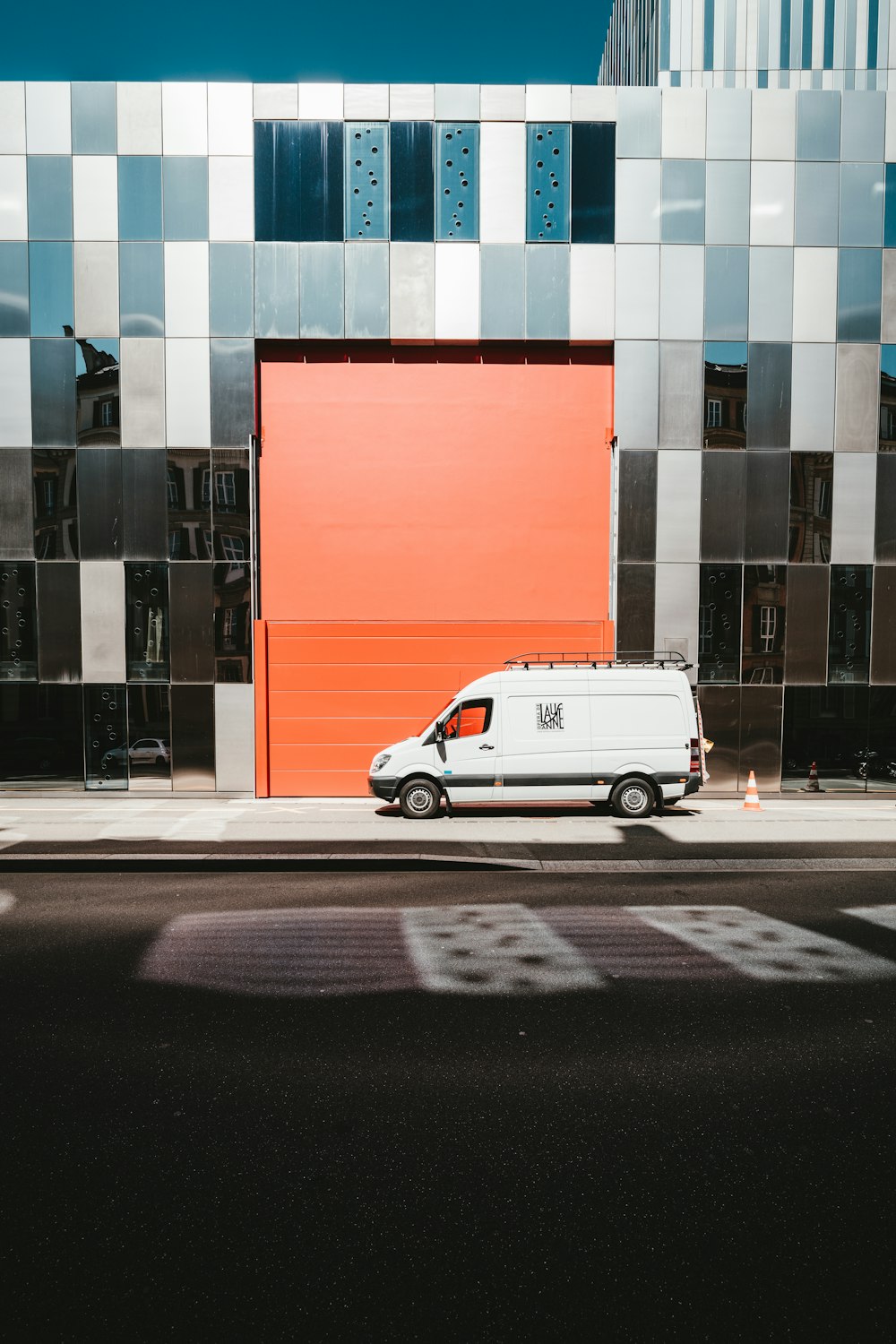 a van is parked in front of a building