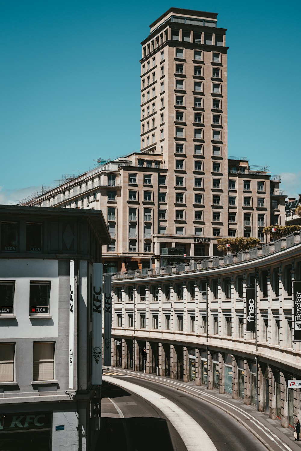 a very tall building sitting next to a street