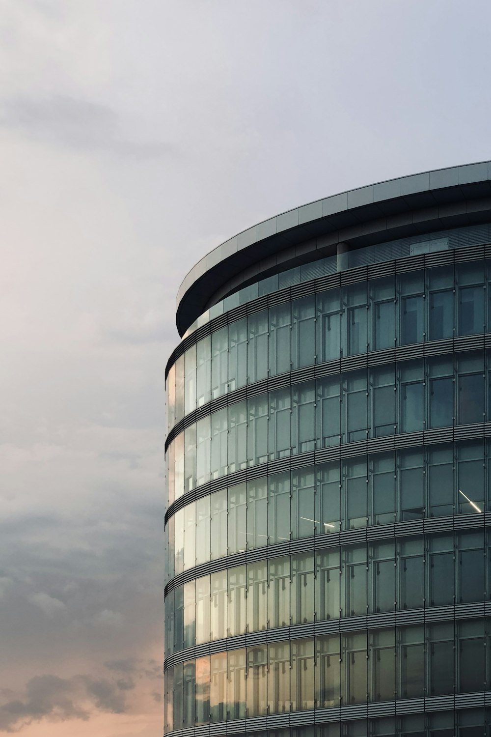 a building with a plane flying in the sky