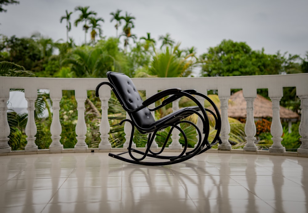 a rocking chair sitting on top of a tiled floor