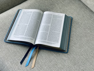 an open book sitting on top of a couch