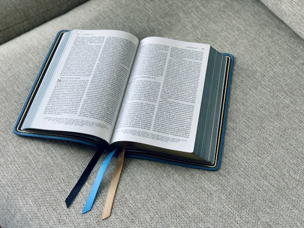 an open book sitting on top of a couch