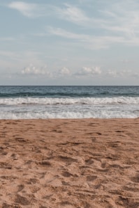 a beach with waves coming in to shore