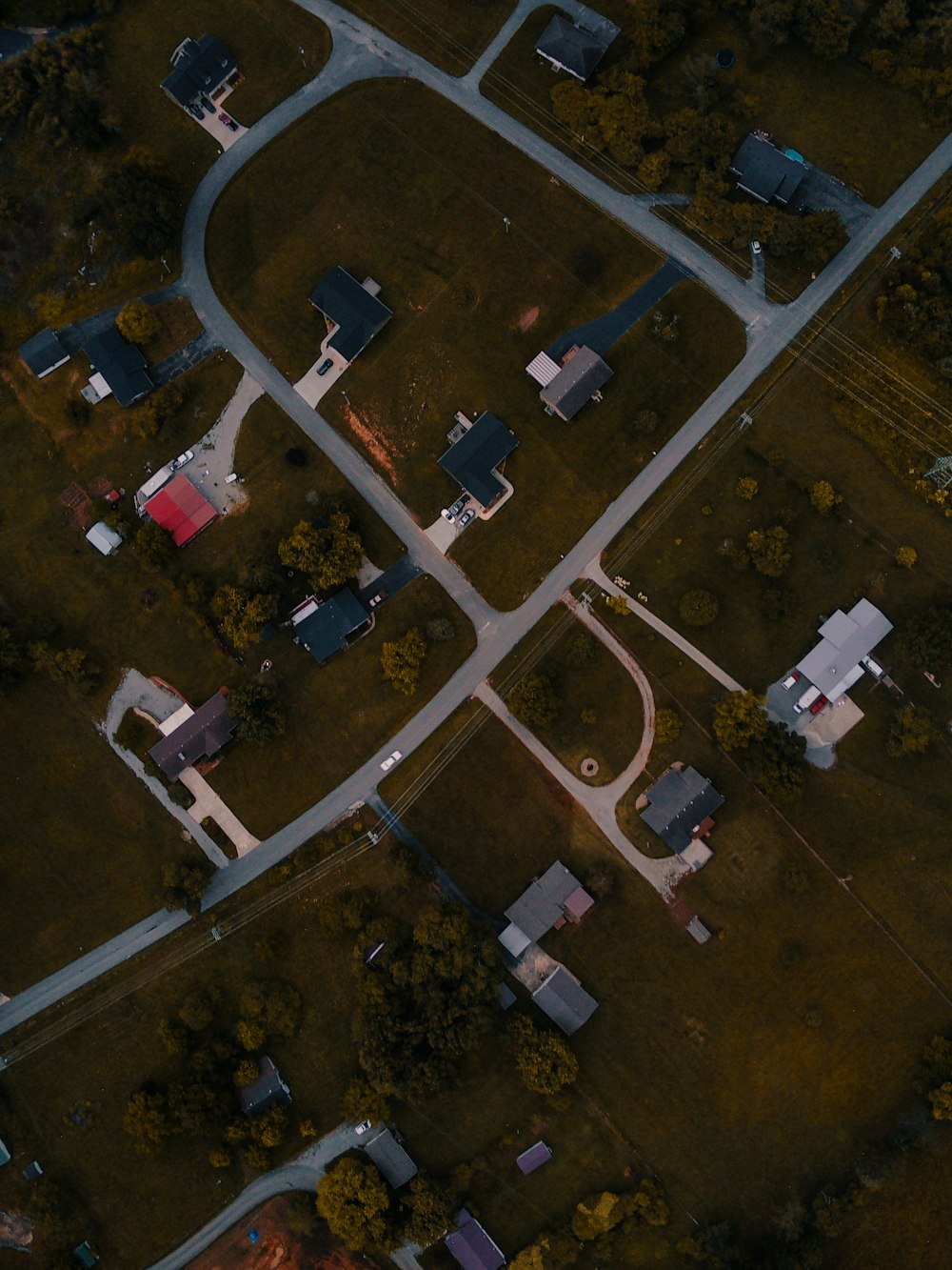 an aerial view of an intersection in a neighborhood