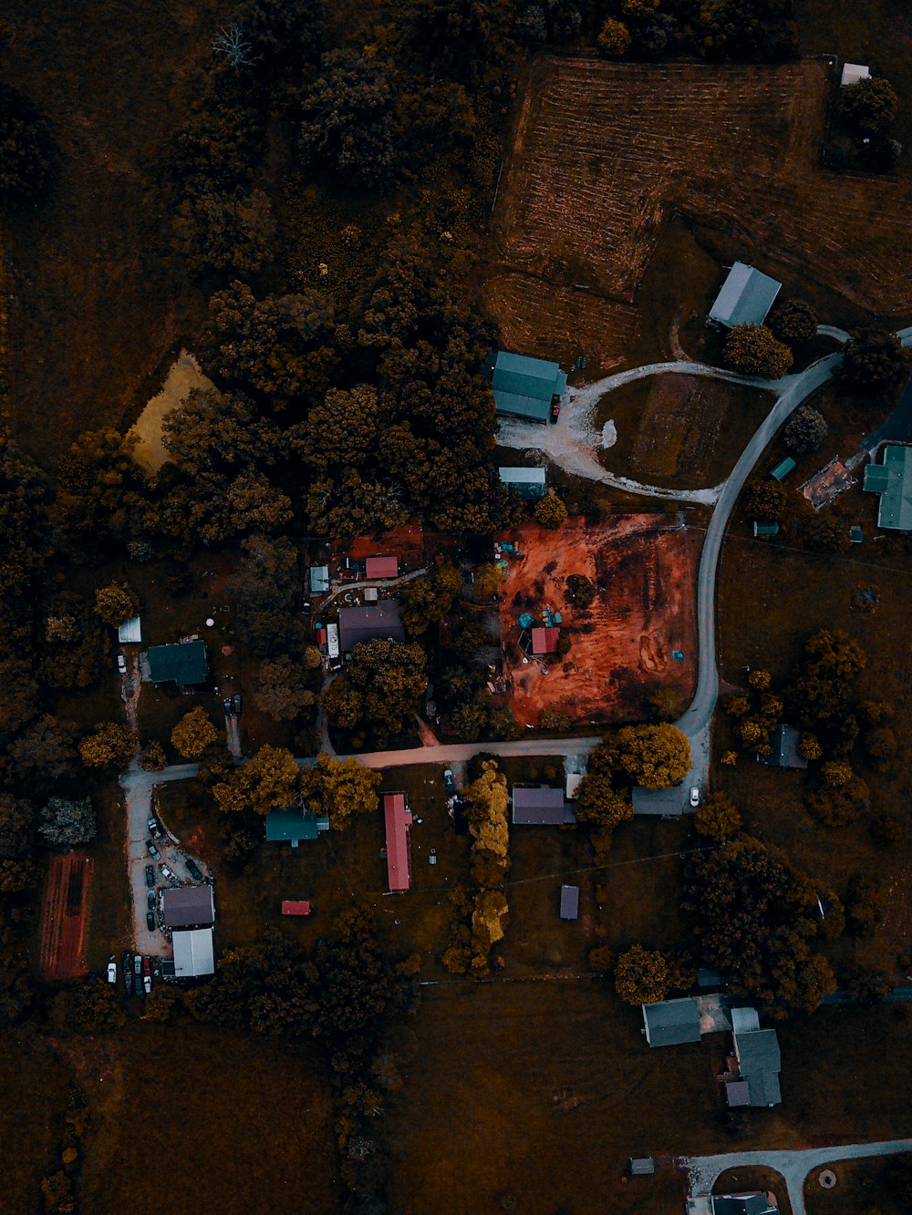 an aerial view of a house with a fire in the middle of it