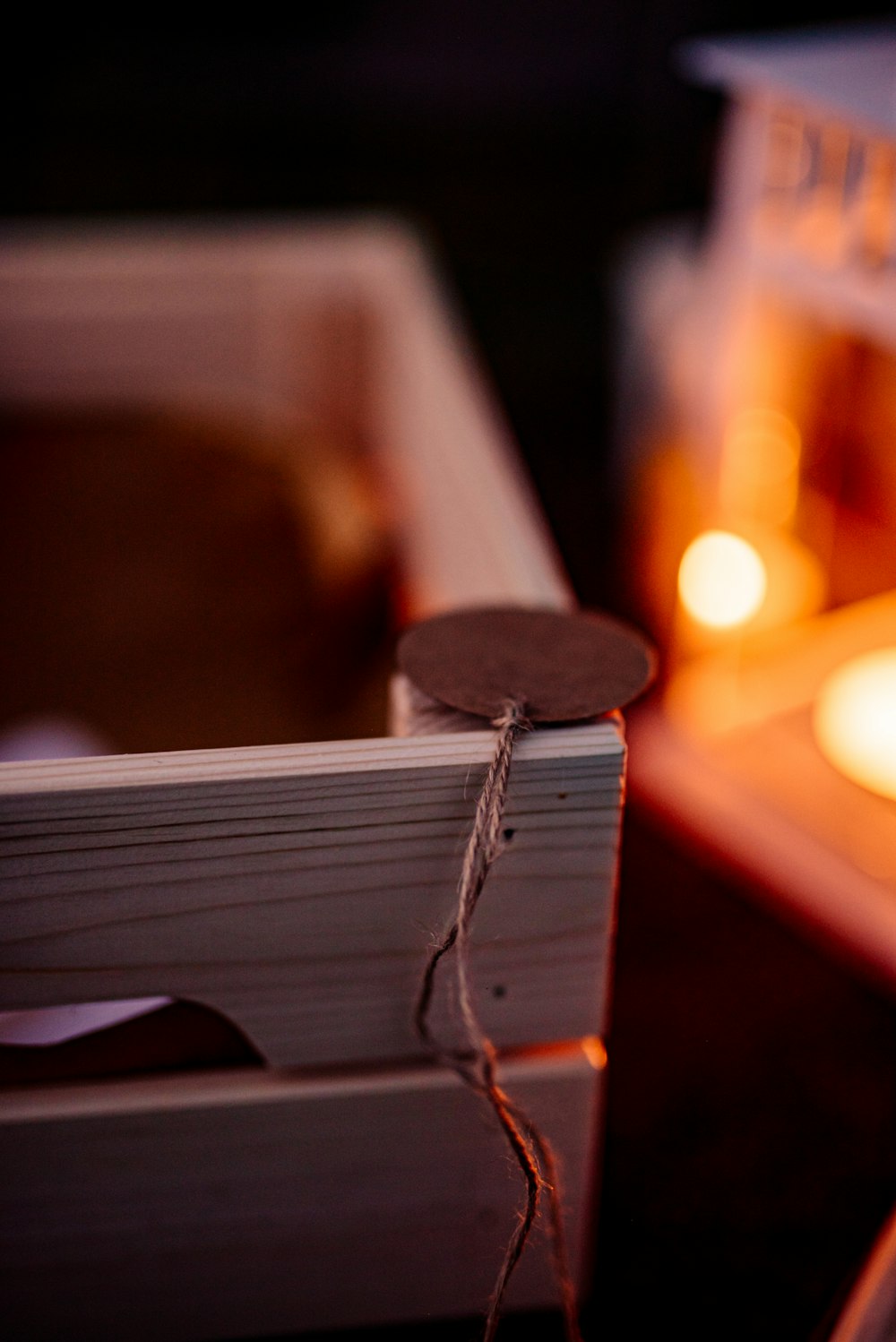 a close up of a candle and a box