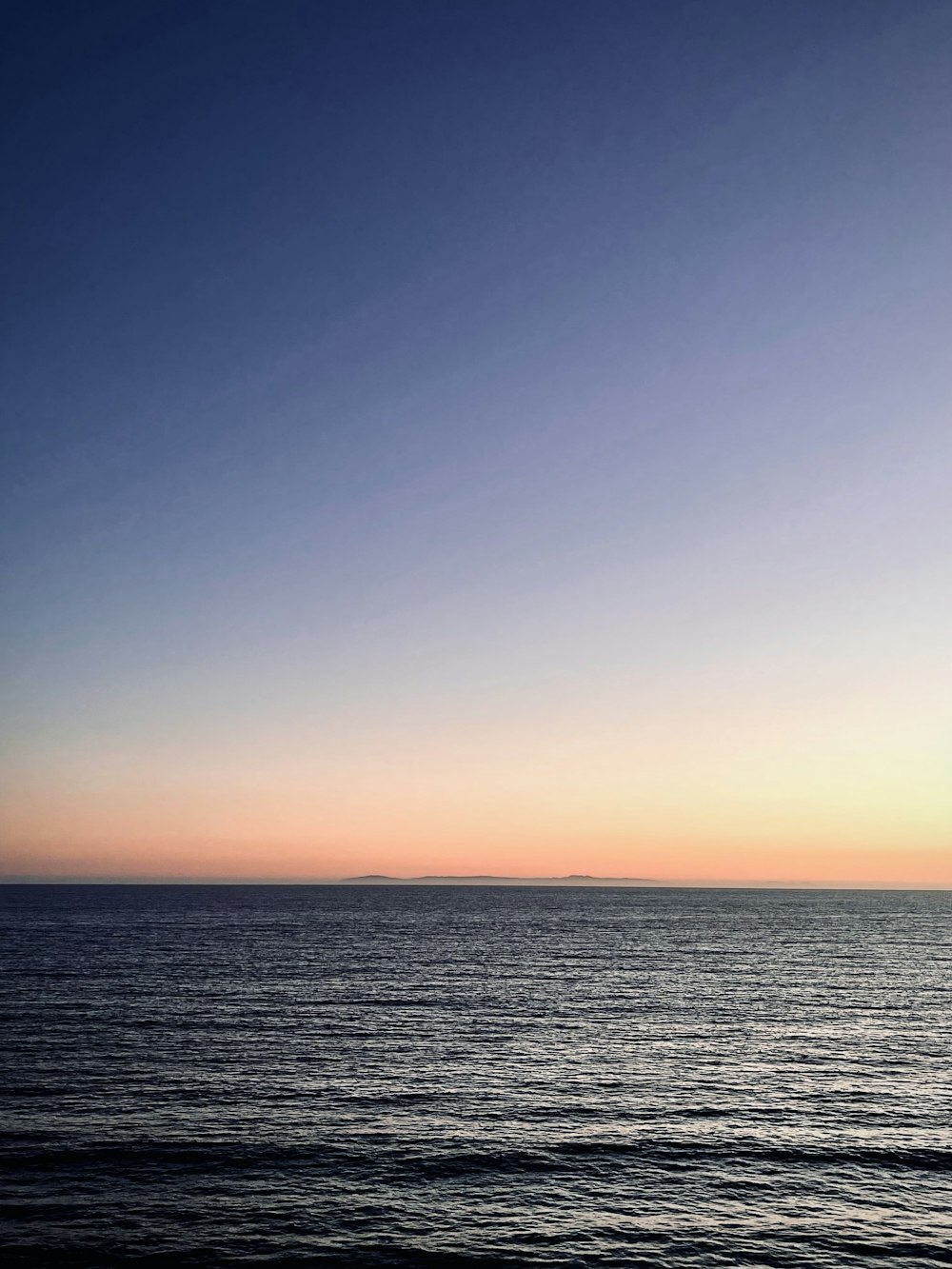 a view of a body of water at sunset