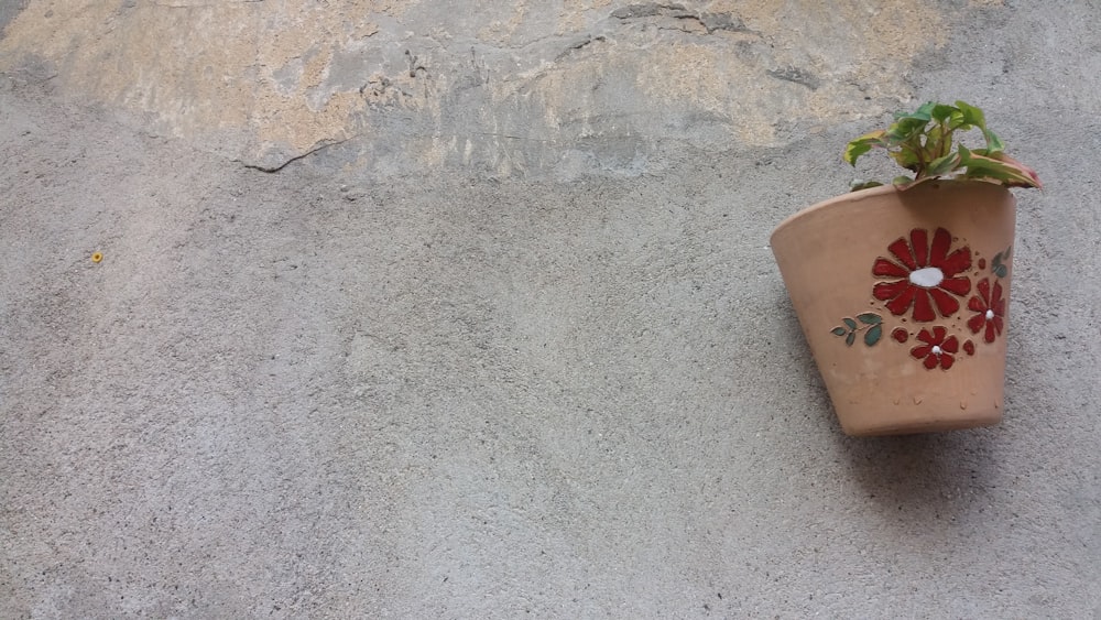 a flower pot with a plant growing out of it