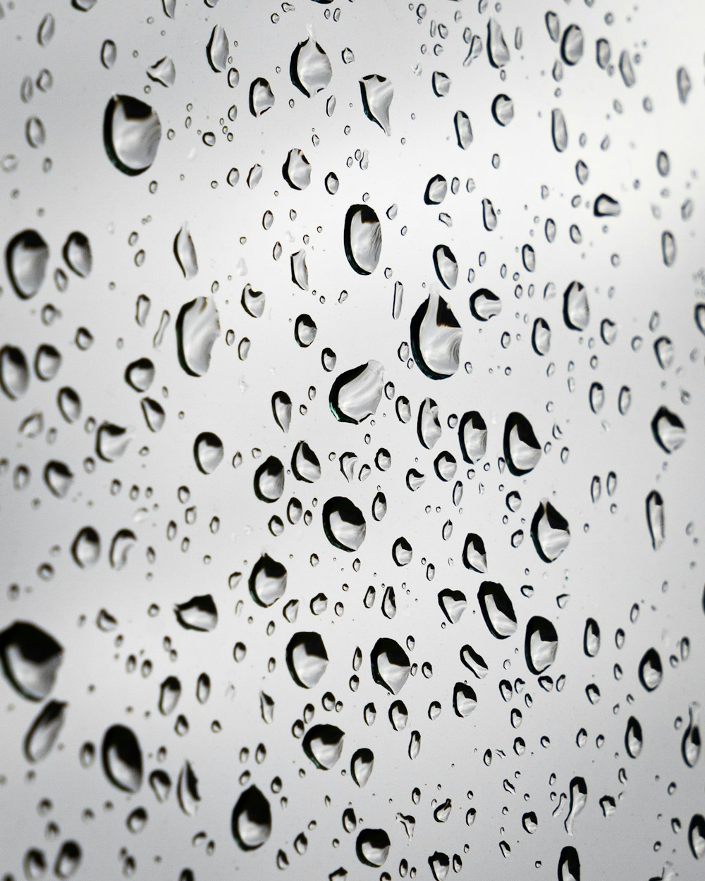 a close up of a rain covered window