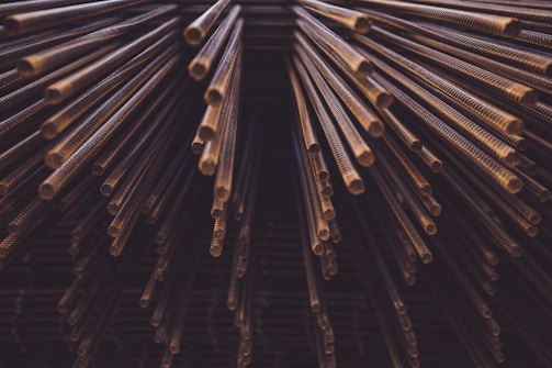 Copper phosphorous alloy rods neatly arranged on a workbench