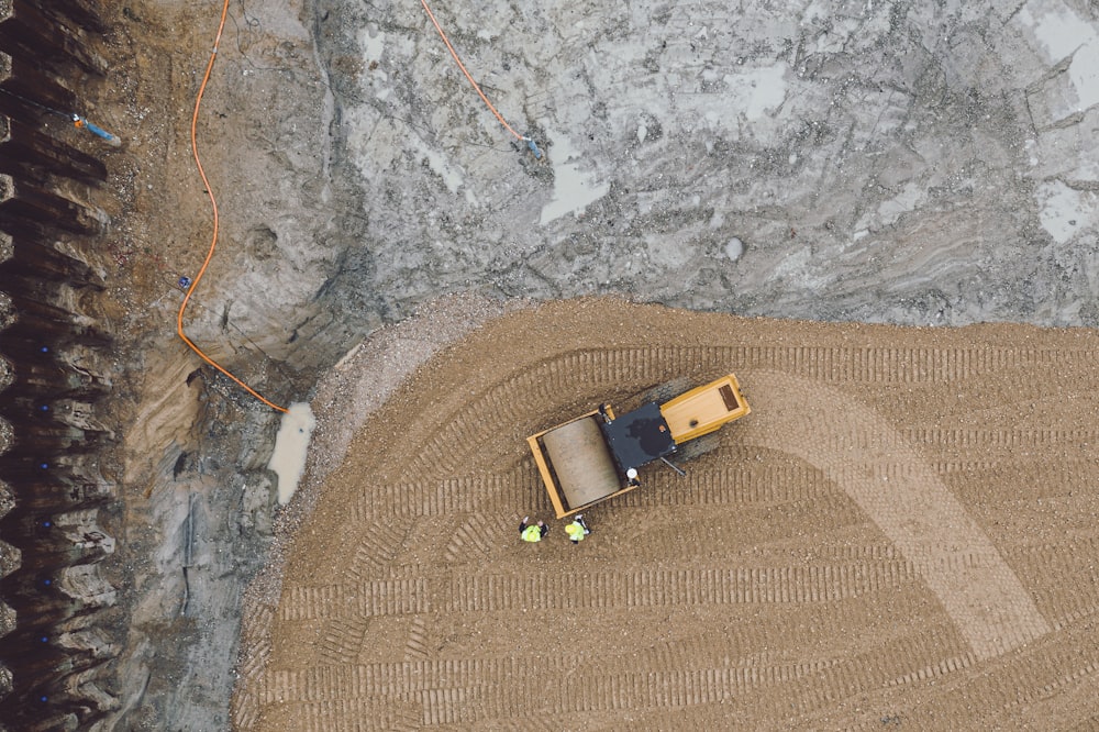 an aerial view of a tractor in a field