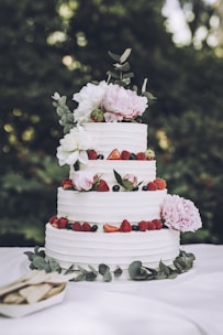 A stunning wedding cake adorned with fresh flowers.