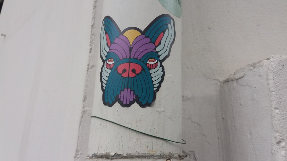 a sticker of a dog on the side of a building