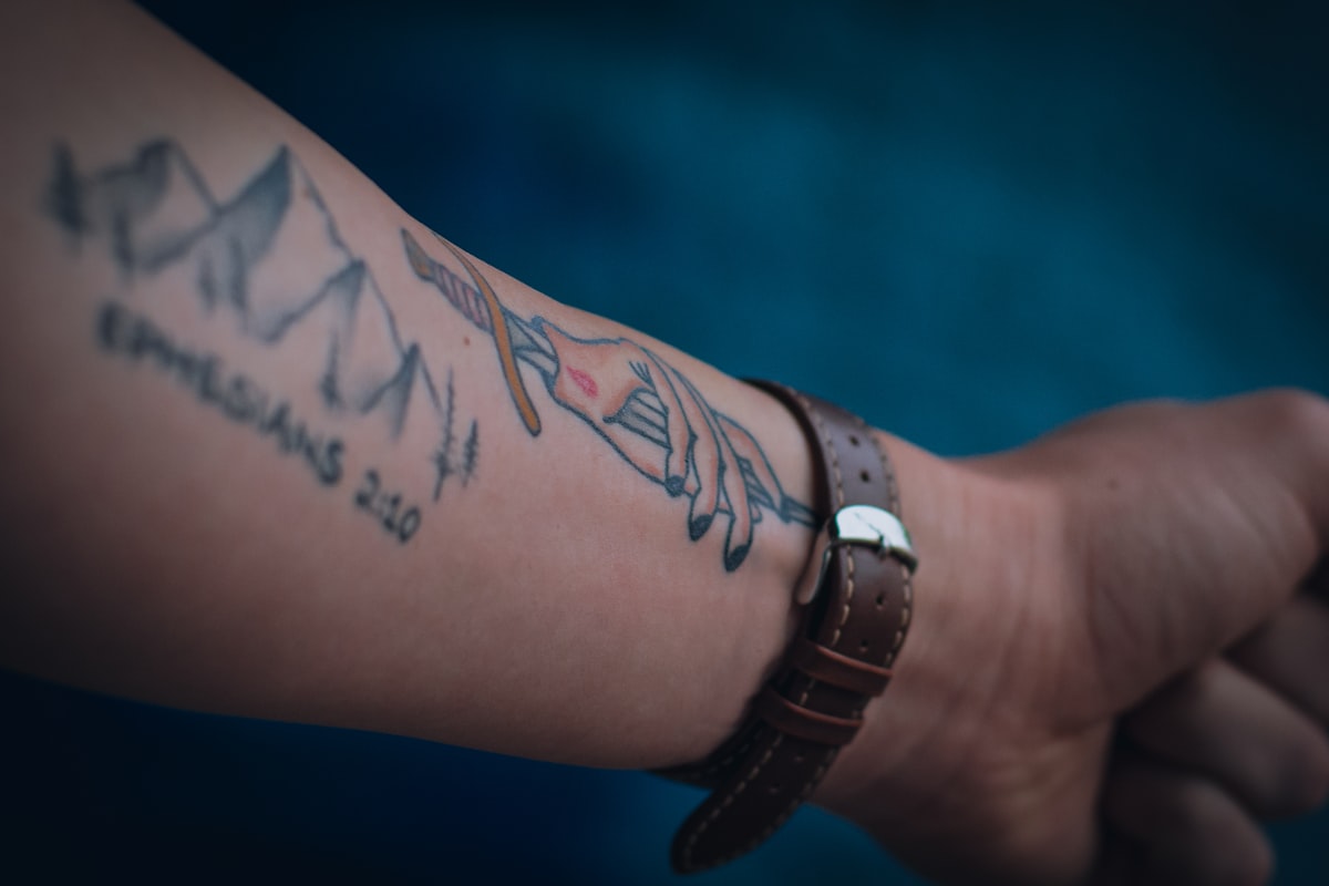 A close-up of a tattooed forearm