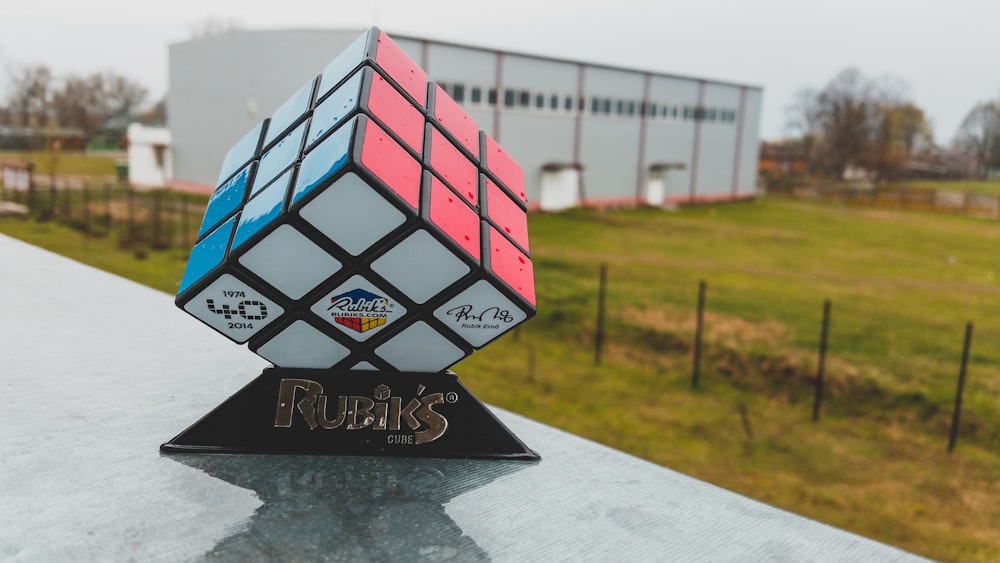 a rubiks rubiks cube on top of a building