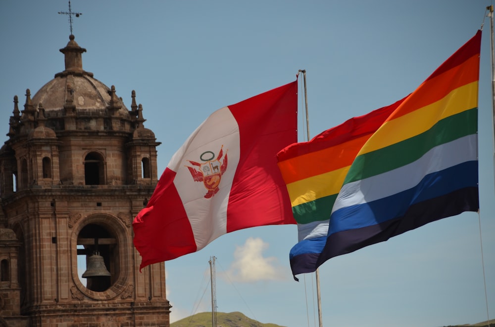 a couple of flags flying next to each other