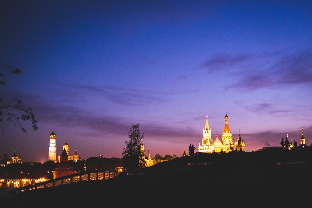 a view of a city at night from across the river