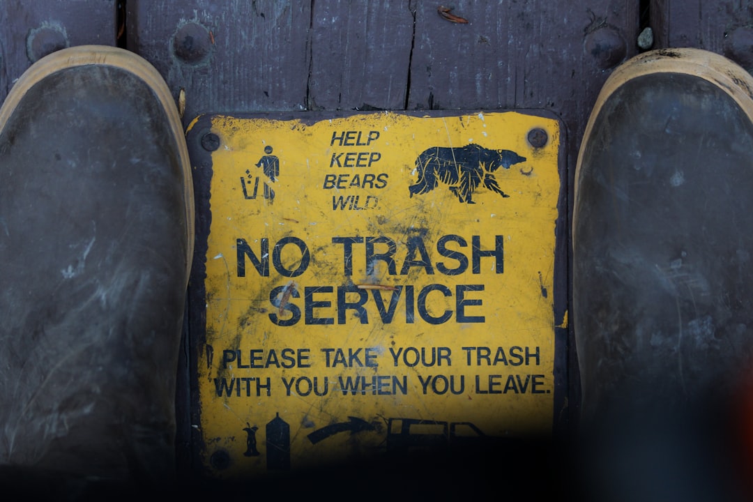 a no trash service sign on a wooden door, HELP KEEP BEARS WILD
