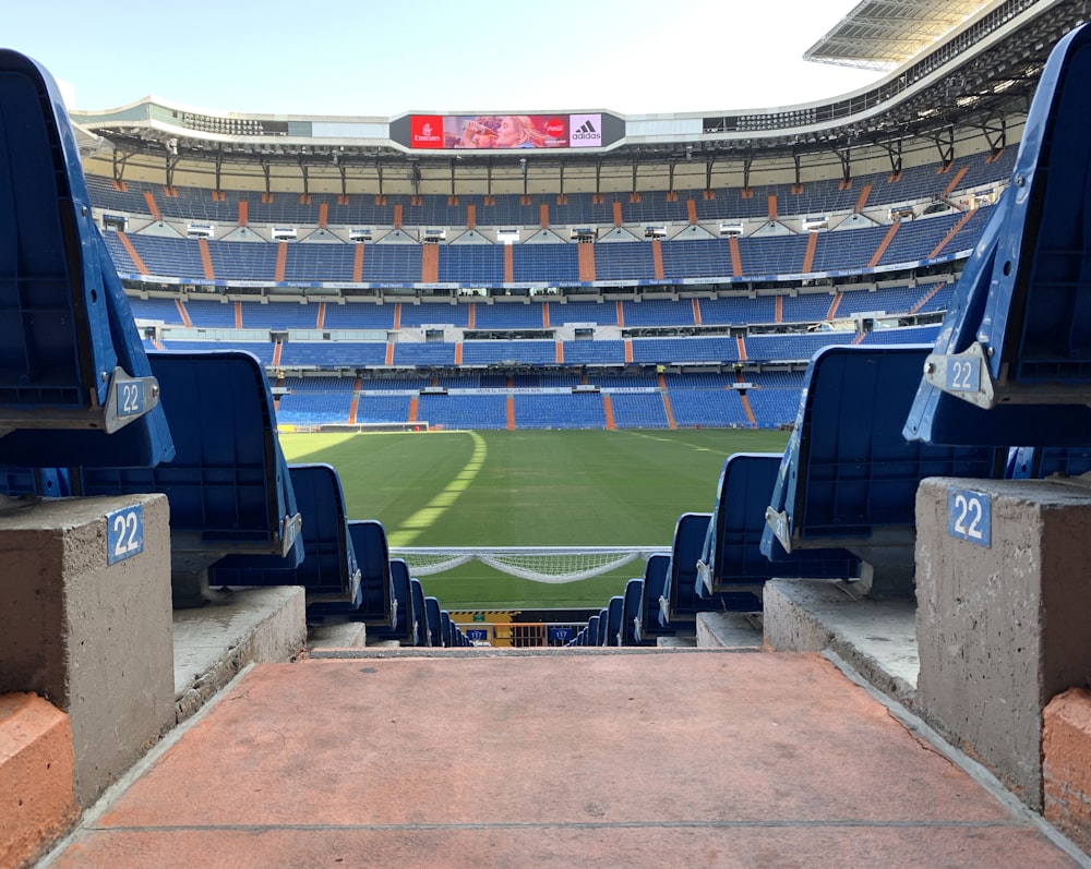 a stadium filled with lots of blue seats