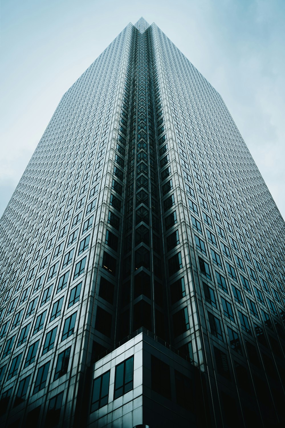 a very tall building with a sky background