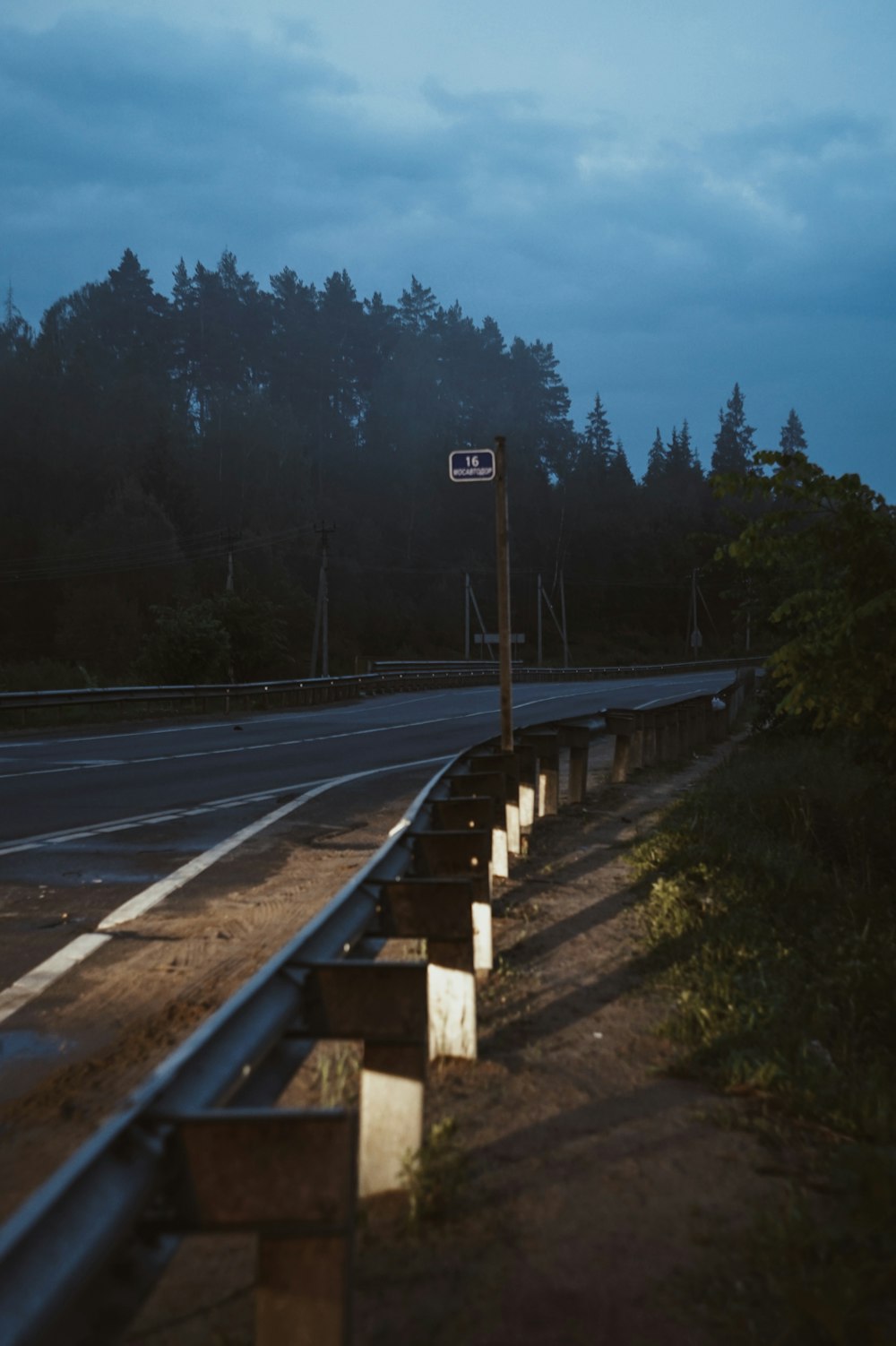 a street sign sitting on the side of a road