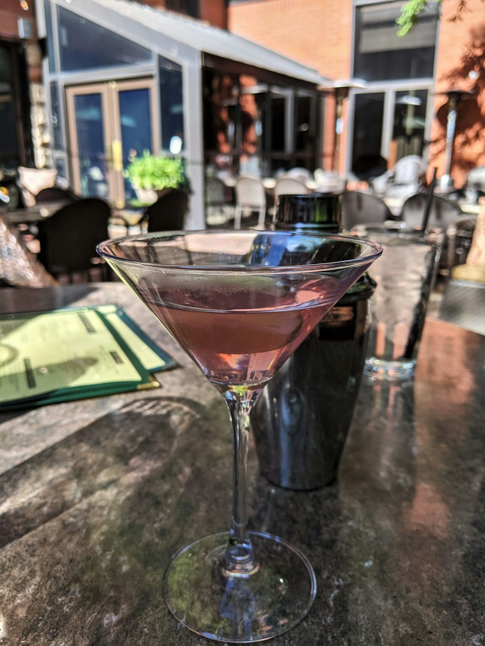 a close up of a wine glass on a table