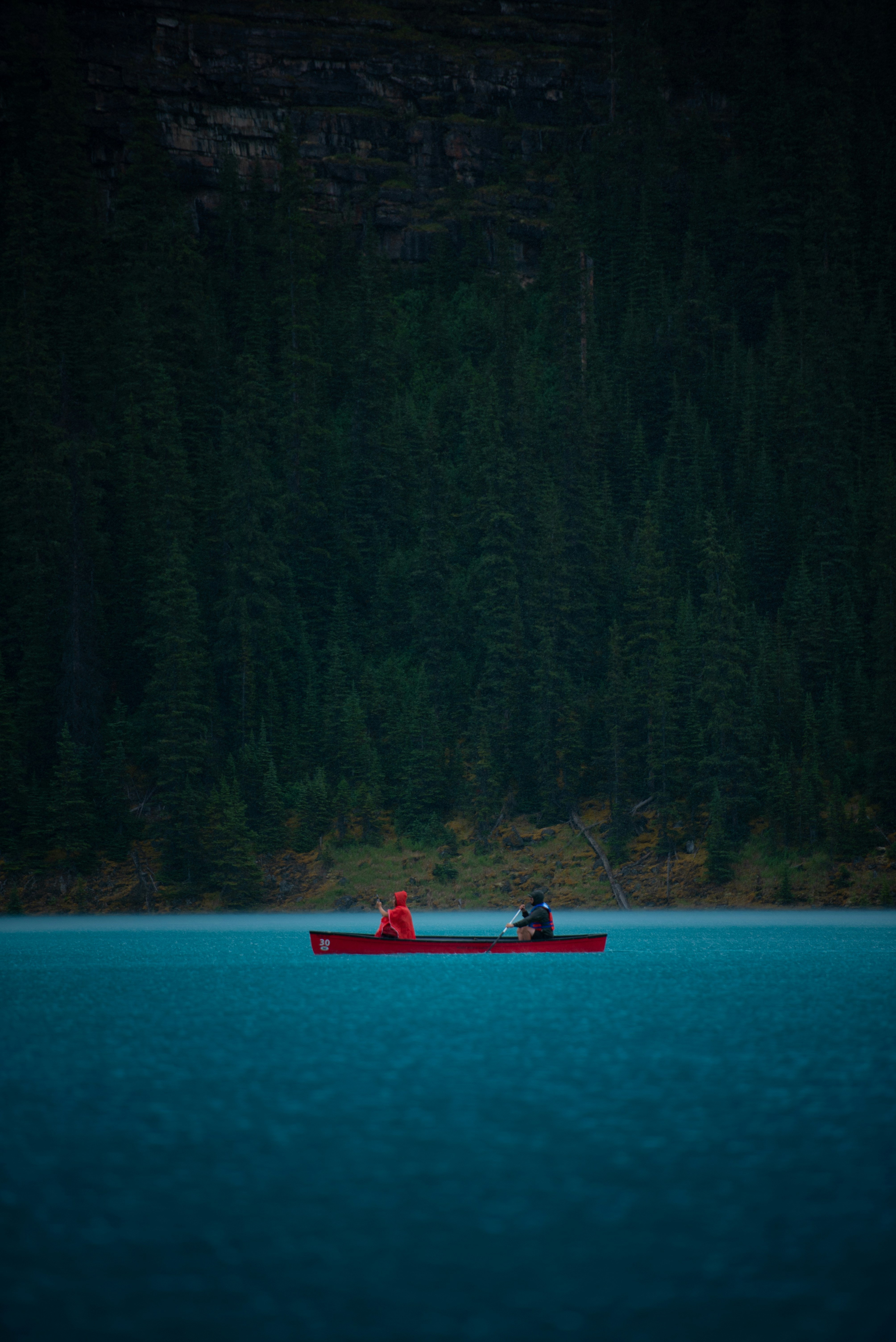 Two canoers in a rainstorm. Follow the IG - Valley_Films