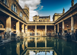 a large building with a pool in the middle of it